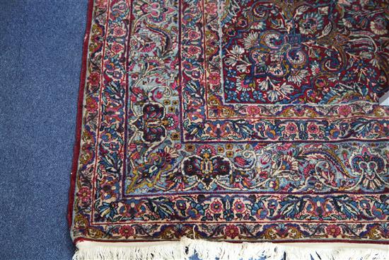 A Kashan red ground carpet, 10ft 2in by 7ft 10in.